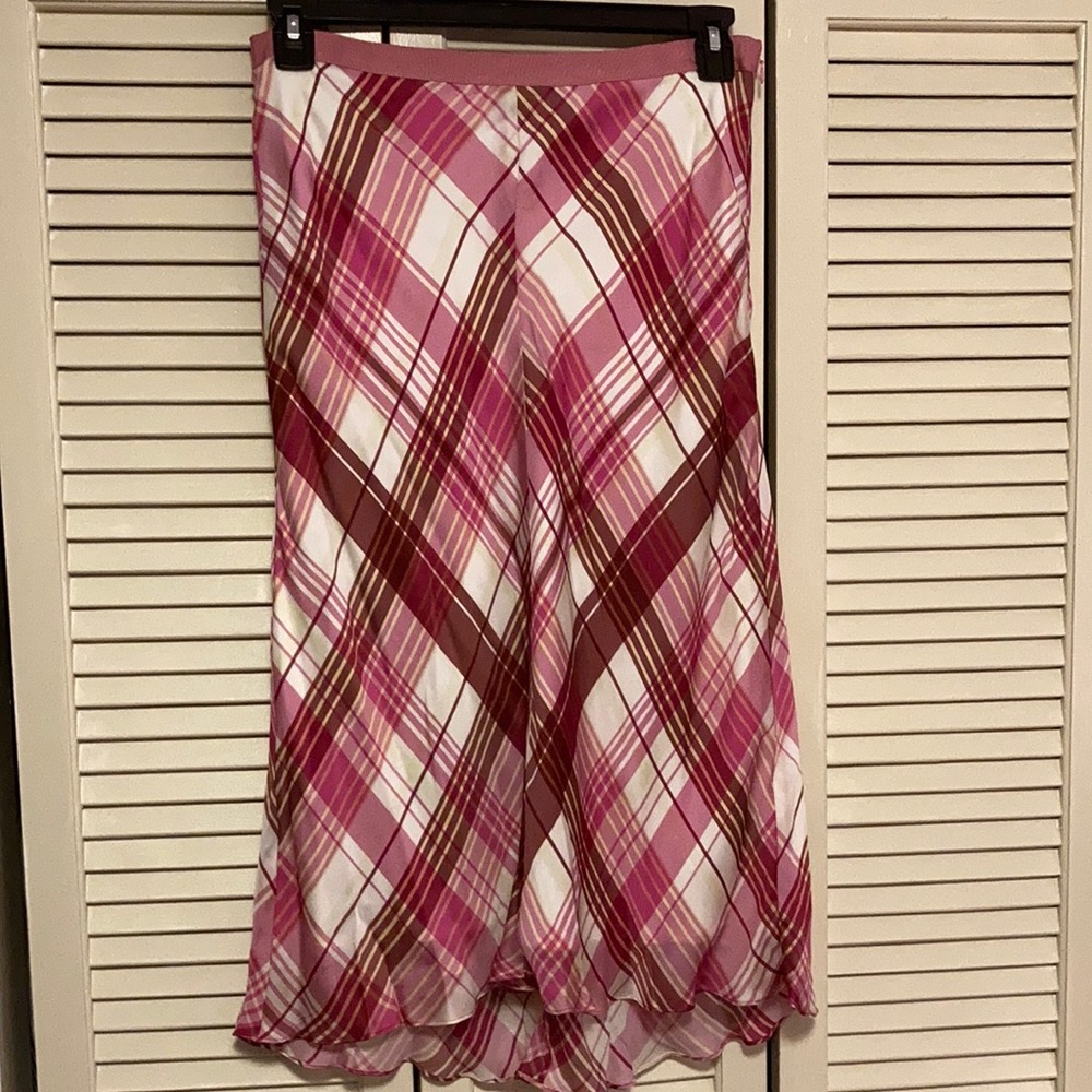 Cutesy flair skirt with warm shades of pinks and ivory plaid.